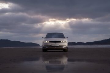 front view of white hyundai car on wet road