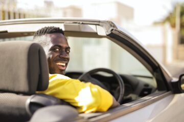 Young man driving car