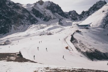 people skiing at a snow covered mountain