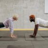 man and woman doing push up