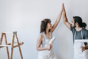 couple done with painting the wall