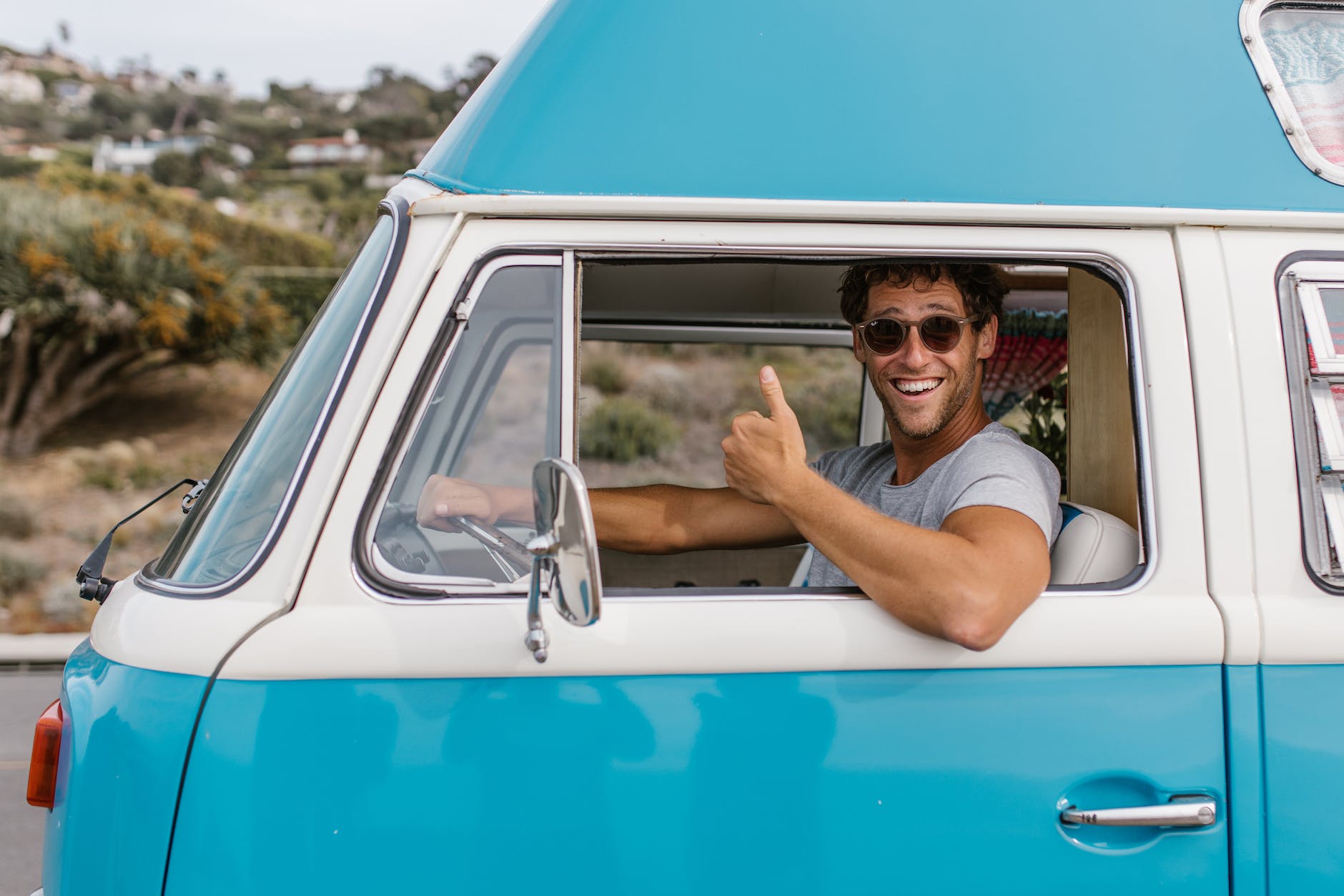 a man driving a camper van