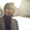 shallow focus photography of man wearing eyeglasses